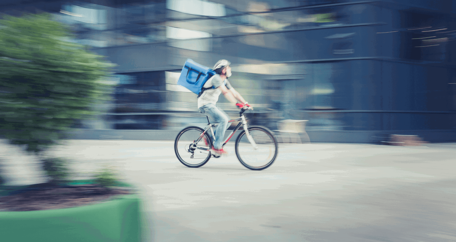 Cyclist going work in the gig economy 